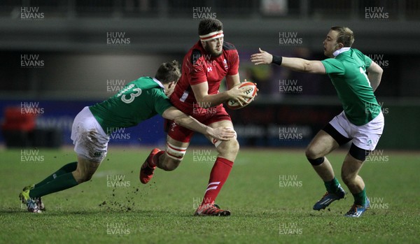 130315 - Wales U20s v Ireland U20s - RBS 6 Nations - Rory Thornton of Wales is tackled by Garry Ringrose and Ciaran Gaffney of Ireland