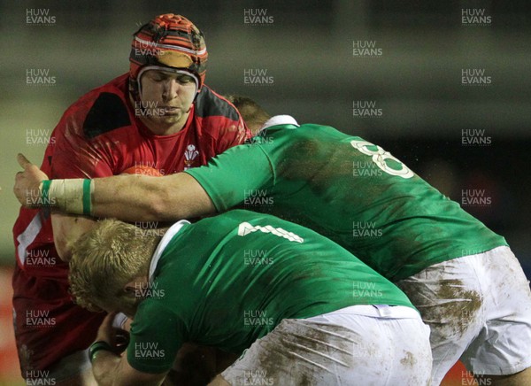 130315 - Wales U20s v Ireland U20s - RBS 6 Nations - Ryan Elias of Wales is tackled by Jeremy Loughman and Lorcan Dow of Ireland