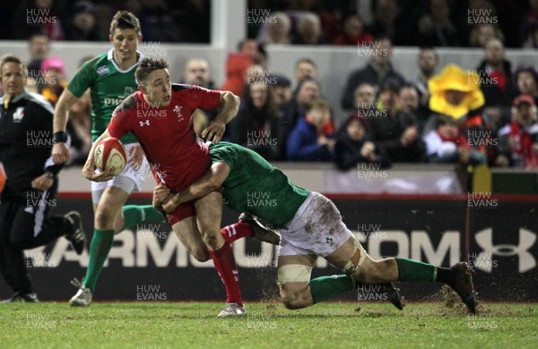 130315 - Wales U20s v Ireland U20s - RBS 6 Nations - Joshua Adams of Wales is tackled by Josh Murphy of Ireland