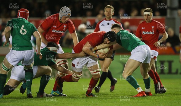 150319 - Wales U20s v Ireland U20s - U20s 6 Nations Championship - Iestyn Rees of Wales is tackled by Sean French of Ireland