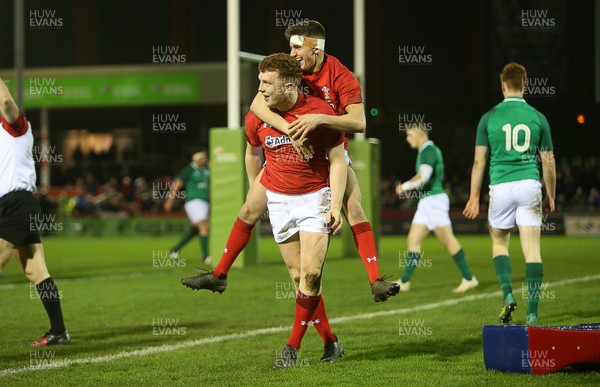 150319 - Wales U20s v Ireland U20s - U20s 6 Nations Championship - Aneurin Owen of Wales celebrates scoring a try with Dafydd Buckland