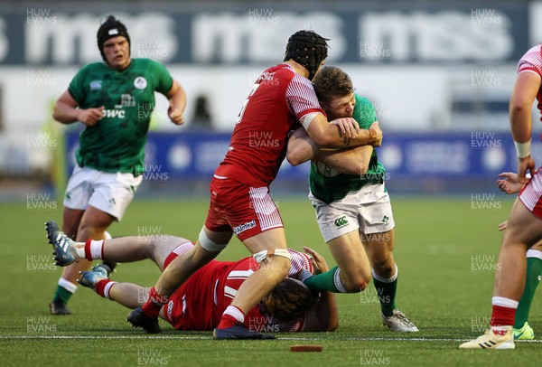 250621 - Wales U20s v Ireland U20s - U20s 6 Nations Championship - Cathal Forde of Ireland is tackled by Alex Mann of Wales