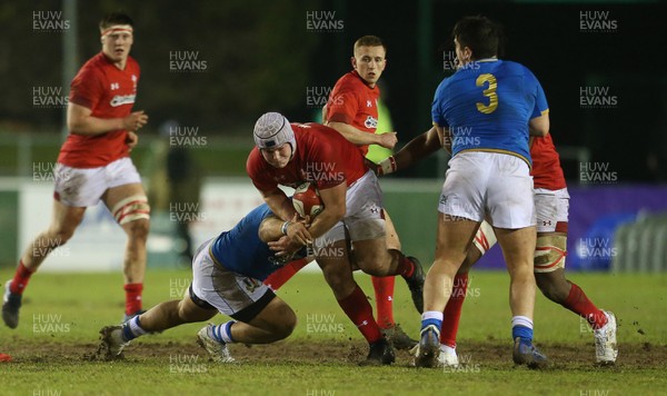 090318 - Wales U20s v Italy U20s - Natwest 6 Nations Championship - Dewi Lake of Wales is tackled by Danilo Fischetti of Italy