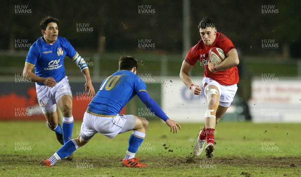 090318 - Wales U20s v Italy U20s - Natwest 6 Nations Championship - Joe Goodchild of Wales is tackled by Antonio Rizzi of Italy