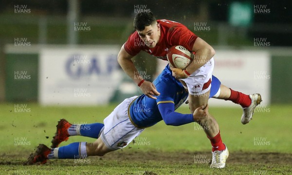 090318 - Wales U20s v Italy U20s - Natwest 6 Nations Championship - Joe Goodchild of Wales is tackled by Antonio Rizzi of Italy