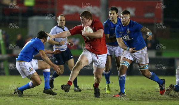 090318 - Wales U20s v Italy U20s - Natwest 6 Nations Championship - Rhys Carre of Wales is tackled by Nicolo Casilio of Italy