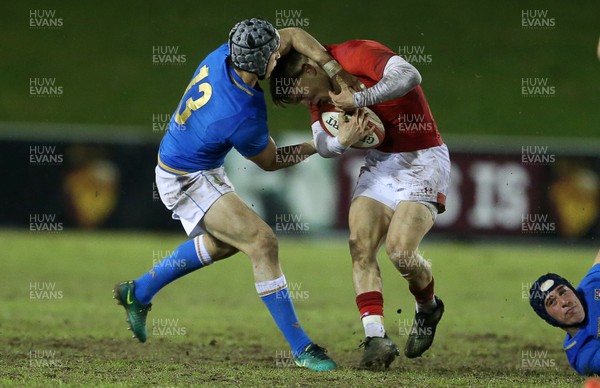 090318 - Wales U20s v Italy U20s - Natwest 6 Nations Championship - Andrea De Masi of Italy receives a yellow card for this tackle on Harri Morgan of Wales