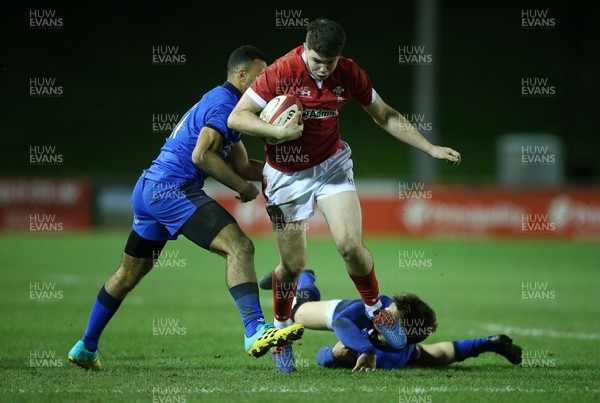 310120 - Wales U20s v Italy U20s - U20s 6 Nations Championship - Osian Knott of Wales is tackled by Michel Mba and Giulio Bertaccini of Italy