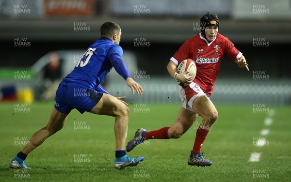 310120 - Wales U20s v Italy U20s - U20s 6 Nations Championship - Dan John of Wales is tackled by Jacopo Trulla of Italy