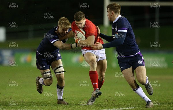 020218 - Wales U20s v Scotland U20s - Natwest 6 Nations - Corey Baldwin of Wales is tackled by Archie Erskine and Stafford McDowell of Scotland