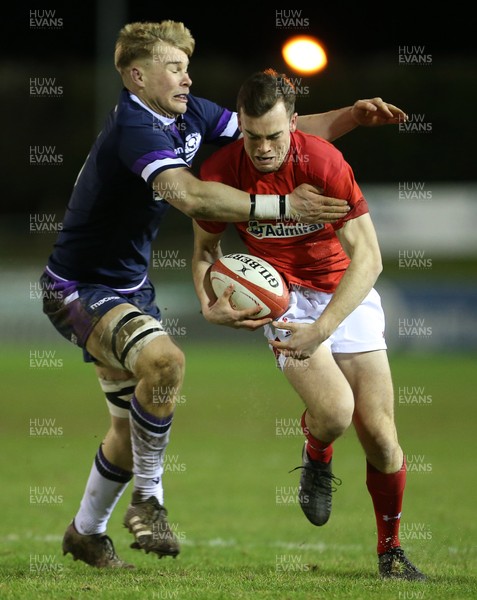 020218 - Wales U20s v Scotland U20s - Natwest 6 Nations - Cai Evans of Wales is tackled by Archie Erskine of Scotland
