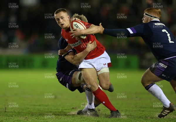 020218 - Wales U20s v Scotland U20s - Natwest 6 Nations - Ben Jones of Wales is tackled by Archie Erskine of Scotland