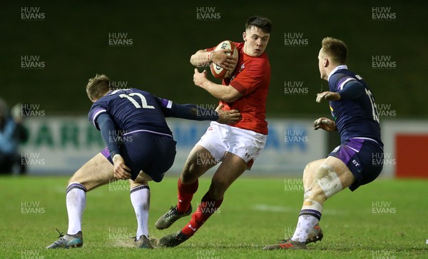 020218 - Wales U20s v Scotland U20s - Natwest 6 Nations - Callum Carson of Wales is tackled by Stafford McDowell of Scotland
