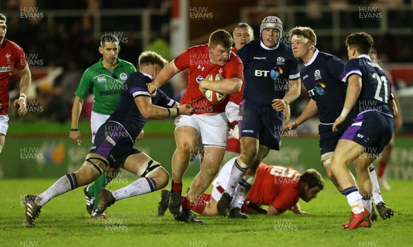 020218 - Wales U20s v Scotland U20s - Natwest 6 Nations - Rhys Carre of Wales is tackled by Archie Erskine of Scotland