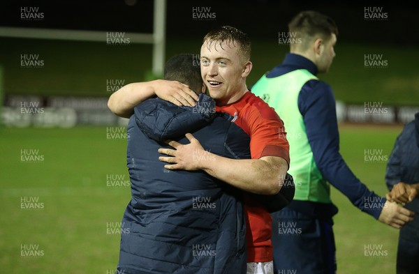 020218 - Wales U20s v Scotland U20s - Natwest 6 Nations - Tommy Reffell of Wales hugs one of the Scots