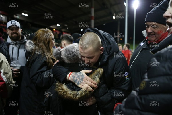 020218 - Wales U20s v Scotland U20s - Natwest 6 Nations - Sam Wainwright of Wales hugs his family at full time