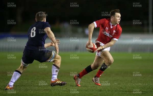 130320 - Wales U20s v Scotland U20s - U20s 6 Nations Championship - Ioan Lloyd of Wales is tackled by Rory Darge of Scotland