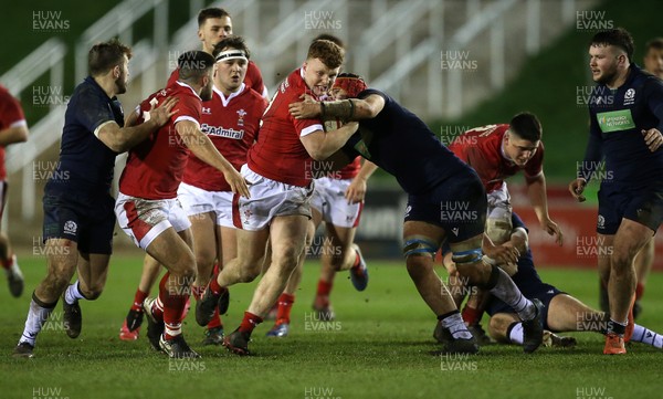 130320 - Wales U20s v Scotland U20s - U20s 6 Nations Championship - Aneurin Owen of Wales is tackled by Connor Boyle of Scotland