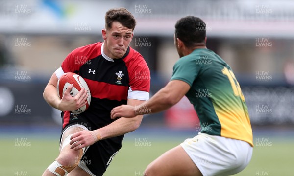080518 - Wales U20s v South Africa U20s - International Friendly - Joe Goodchild of Wales is tackled by Manuel Rass of South Africa