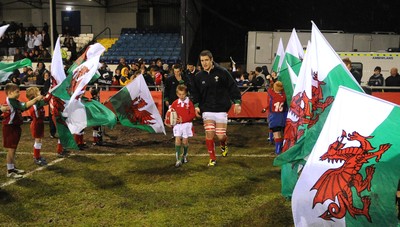 13.02.09 - Wales U20 v England U20 - Under 20 Six Nations 2009 - Wales' James Thomas leads out his team with match mascot. 