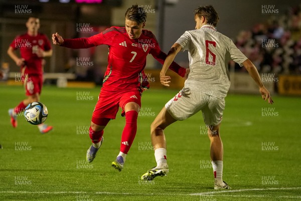 080925 - Wales U21 v Denmark U21 - 2027 UEFA U21 EURO Qualifying - Cian Ashford of Wales U-21 is tackled by William Clem of Denmark U-21