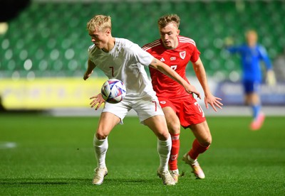 201123 - Wales U21 v Denmark U21 - European Under-21 Championship 2025 Qualifier - Tobias Bech of Denmark is tackled by Eli King of Wales
