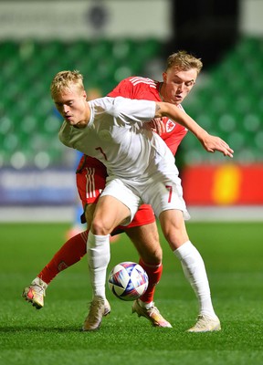 201123 - Wales U21 v Denmark U21 - European Under-21 Championship 2025 Qualifier - Tobias Bech of Denmark is tackled by Eli King of Wales