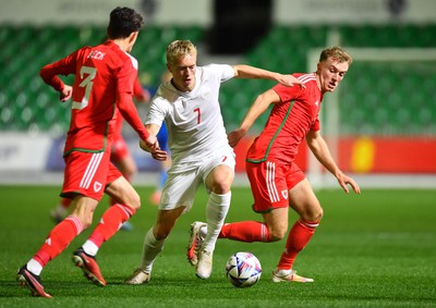 201123 - Wales U21 v Denmark U21 - European Under-21 Championship 2025 Qualifier - Tobias Bech of Denmark is tackled by Eli King of Wales