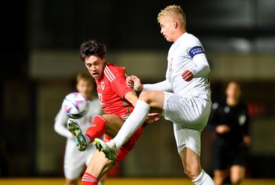 201123 - Wales U21 v Denmark U21 - European Under-21 Championship 2025 Qualifier - Christopher Popov of Wales is tackled by Oliver Nielsen of Denmark