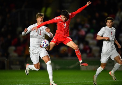 201123 - Wales U21 v Denmark U21 - European Under-21 Championship 2025 Qualifier - Owen Beck of Wales is challenged by Thomas Kristensen of Denmark