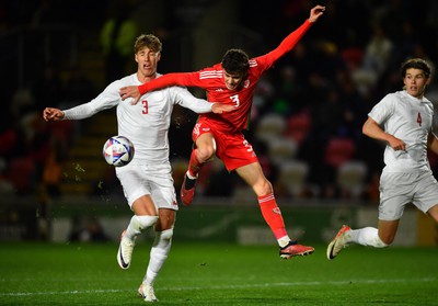 201123 - Wales U21 v Denmark U21 - European Under-21 Championship 2025 Qualifier - Owen Beck of Wales is challenged by Thomas Kristensen of Denmark