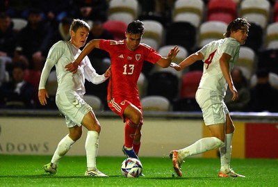 201123 - Wales U21 v Denmark U21 - European Under-21 Championship 2025 Qualifier - Luke Harris of Wales is tackled by David Kruse of Denmark