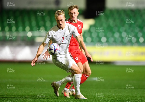 201123 - Wales U21 v Denmark U21 - European Under-21 Championship 2025 Qualifier - Tobias Bech of Denmark is tackled by Eli King of Wales