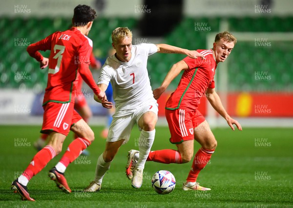 201123 - Wales U21 v Denmark U21 - European Under-21 Championship 2025 Qualifier - Tobias Bech of Denmark is tackled by Eli King of Wales