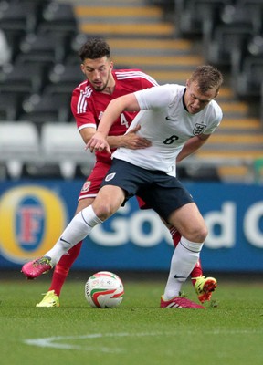 190514 - Wales U21 v England U21 - UEFA Under 21 Qualifying Match - Liam Moore of England is challenged by Lee Lucas of Wales  