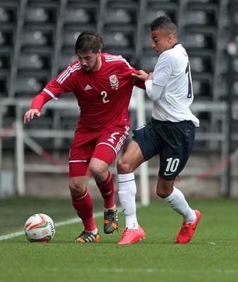 190514 - Wales U21 v England U21 - UEFA Under 21 Qualifying Match - Kieron Freeman of Wales is tackled by Jesse Lingard of England  