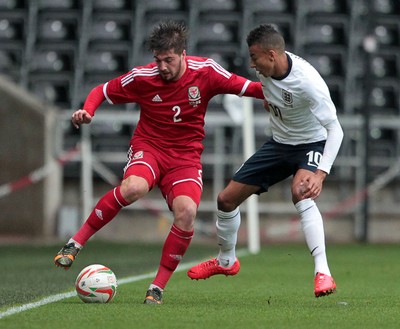190514 - Wales U21 v England U21 - UEFA Under 21 Qualifying Match - Kieron Freeman of Wales is tackled by Jesse Lingard of England  