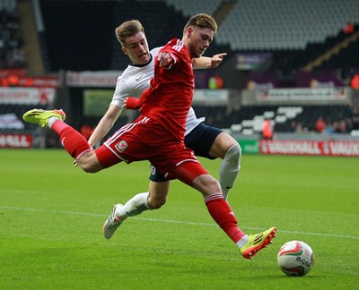 190514 - Wales U21 v England U21 - UEFA Under 21 Qualifying Match - Wes Burns of Wales is tackled by Luke Garbutt of England  