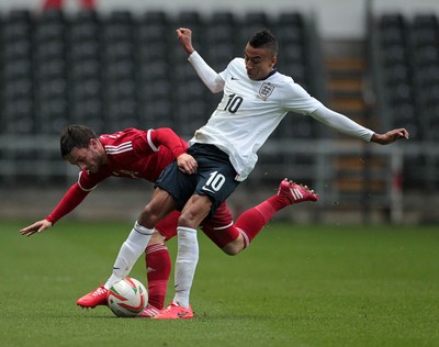 190514 - Wales U21 v England U21 - UEFA Under 21 Qualifying Match - Josh Pritchard of Wales is tackled by Jesse Lingard of England  