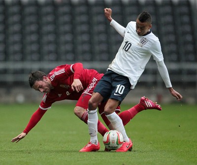 190514 - Wales U21 v England U21 - UEFA Under 21 Qualifying Match - Josh Pritchard of Wales is tackled by Jesse Lingard of England  
