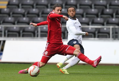 190514 - Wales v England, UEFA Under 21 Qualifying Match, Liberty Stadium, Swansea - England's Nathan Redmond crosses as Wales' Josh Pritchard challenges