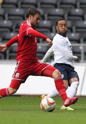 190514 - Wales v England, UEFA Under 21 Qualifying Match, Liberty Stadium, Swansea - England's Nathan Redmond crosses as Wales' Josh Pritchard challenges
