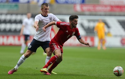 190514 - Wales v England, UEFA Under 21 Qualifying Match, Liberty Stadium, Swansea - Wales' Lee Lucas holds off England's James Ward-Prowse