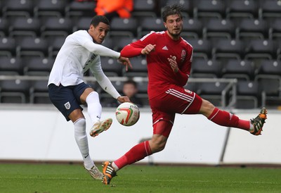 190514 - Wales v England, UEFA Under 21 Qualifying Match, Liberty Stadium, Swansea - England's Tom Ince crosses as Wales' Kieron Freeman attempts to block