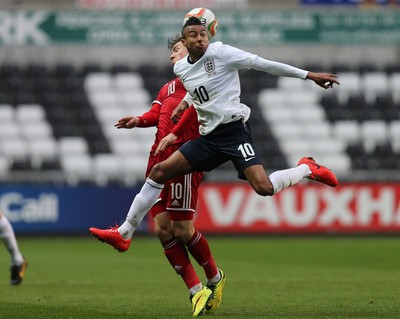 190514 - Wales v England, UEFA Under 21 Qualifying Match, Liberty Stadium, Swansea - England's Jesse Lingard and Wales' Lee Evans compete for the ball