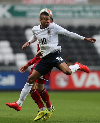 190514 - Wales v England, UEFA Under 21 Qualifying Match, Liberty Stadium, Swansea - England's Jesse Lingard and Wales' Lee Evans compete for the ball