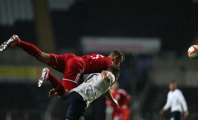 190514 - Wales v England, UEFA Under 21 Qualifying Match, Liberty Stadium, Swansea - Wales' George Ray gets above England's Liam Moore to head ball