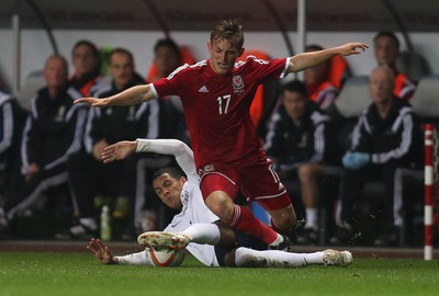 190514 - Wales v England, UEFA Under 21 Qualifying Match, Liberty Stadium, Swansea - Wales' George Williams is tackled by England's Tom Ince