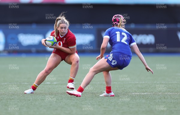 180426 - Wales U21 v France U21, Women's Under-21 Six Nations Summer Series - Freya Bell of Wales takes on Charlie Gauyat of France