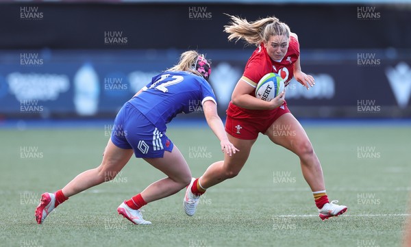180426 - Wales U21 v France U21, Women's Under-21 Six Nations Summer Series - Freya Bell of Wales takes on Charlie Gauyat of France